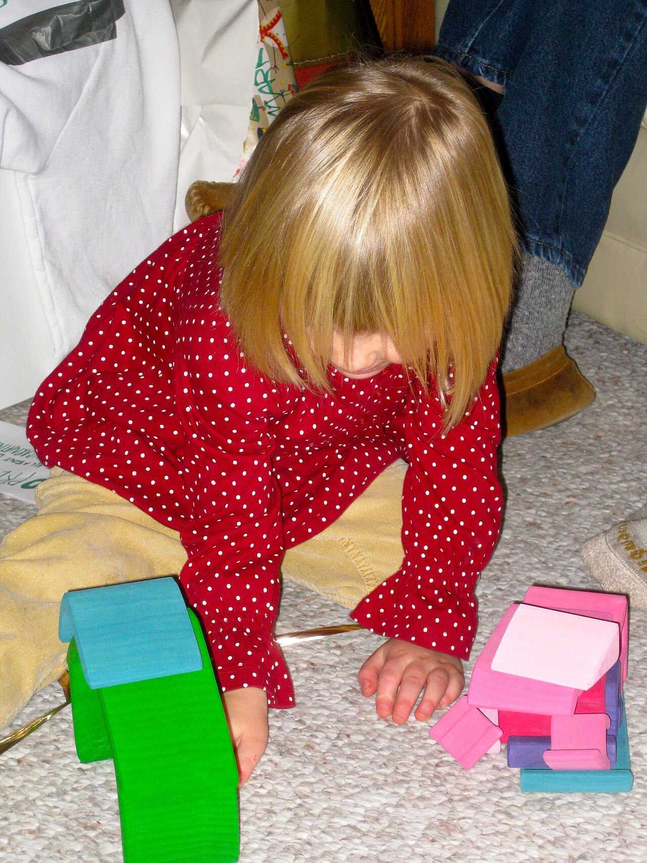 Child playing with wooden blocks